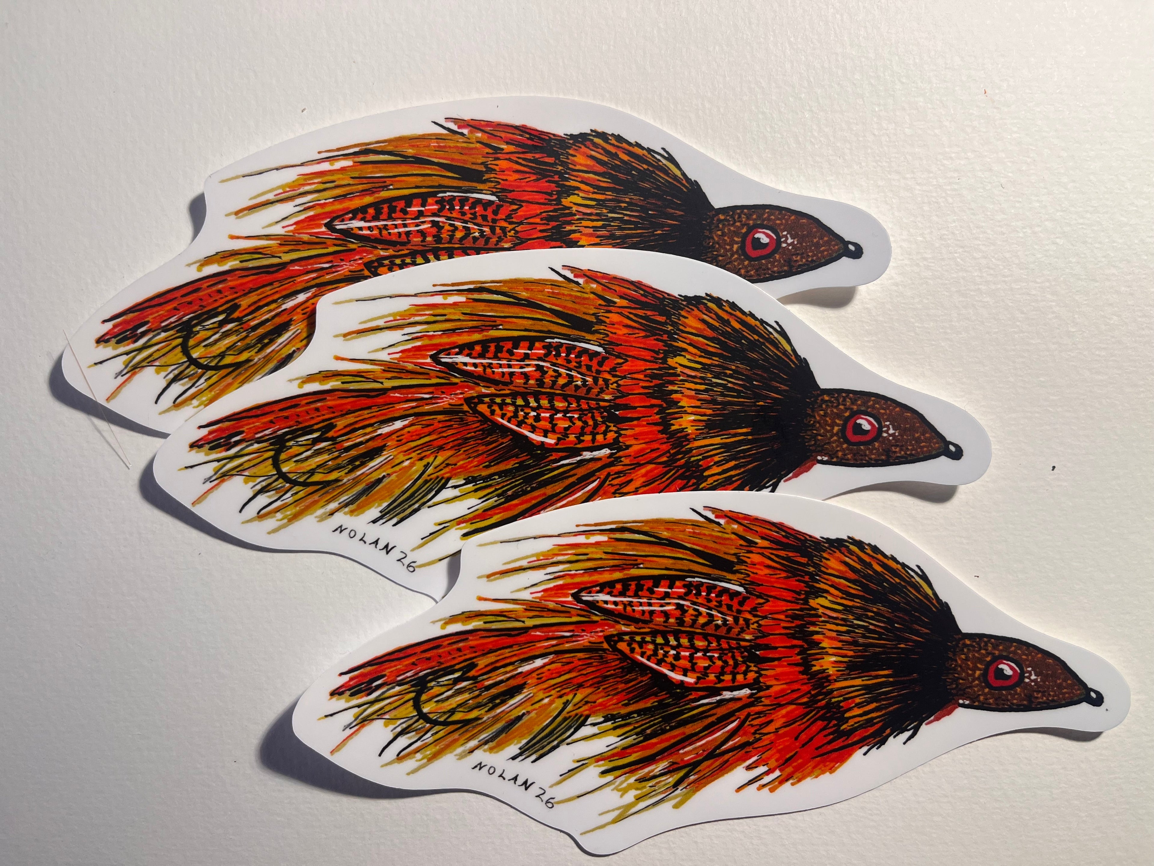 Three colorful Streamer stickers on a light gray background